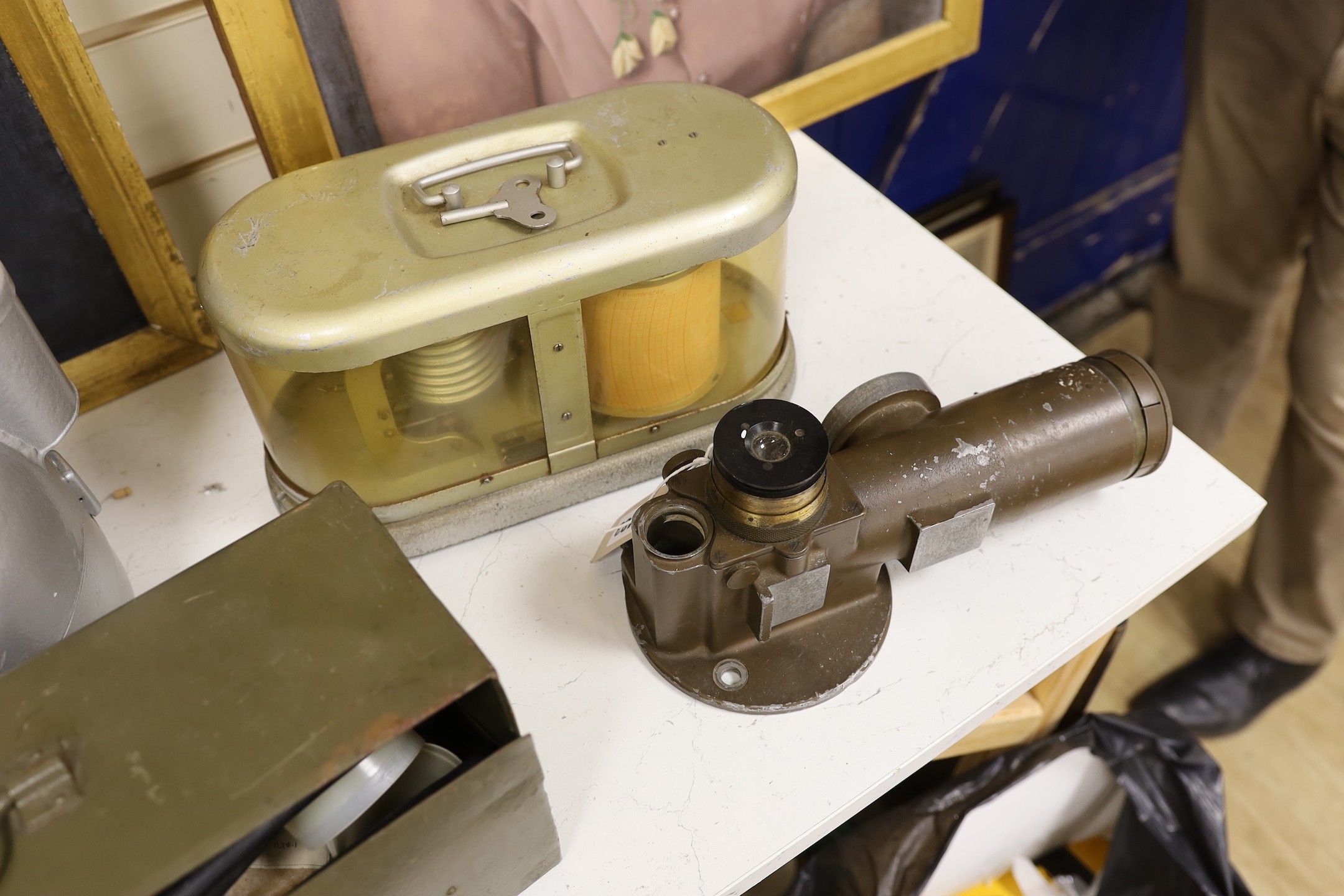 A World War Two gun-sight, ship's binnacle, barograph, etc.